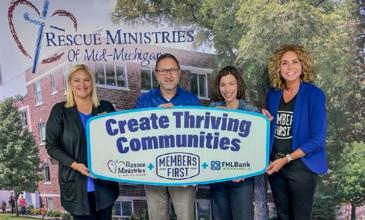 Members First presents check to Rescue Ministries of Mid-Michigan